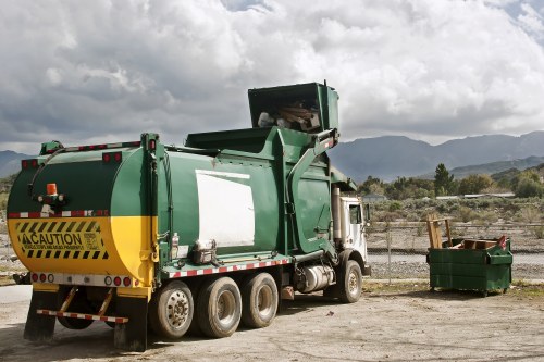Workers loading a small van at a commercial unit
